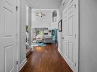 Entryway with large coat closet and half bath