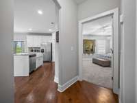 Hallway from laundry room leading to kitchen or owner's suite