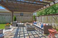 This flagstone paver patio is so comfy and fun with a beautiful pergola above.  Seller will leave patio furniture if buyer wants/needs.