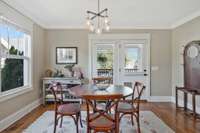 Cute breakfast room with so much natural light and convenience to kitchen and family room and opens onto the covered back porch.