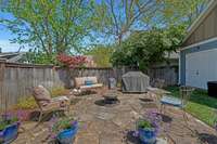 This second flagstone patio is where the grilling action is and conveniently tucked behind the carport.