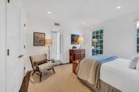 Bedroom 4 - bath en suite, floor to ceiling windows, custom cut rug and built in bookshelves