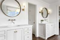 Primary bath has double vanities, marble tops, Rohl fixtures throughout