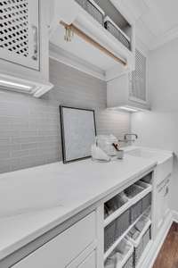 Laundry room with built ins & sink