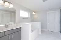 Separated vanities in your spa-like Owner's Bath   *Photo not of actual home