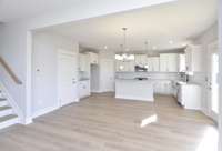 Open concept with kitchen and casual dining.  *Photo not of actual home