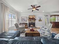 Grand living room with wood burning fireplace