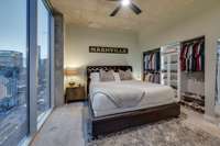 Bedroom with a door! Floor-to-ceiling windows