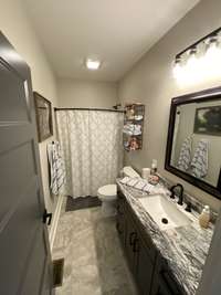 Guest Bath with tub/shower combo and large vanity