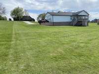 View from back of property toward home and road frontage