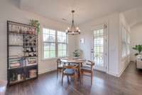 The eat in kitchen overlooks the backyard and leads to a covered porch!