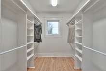 Large walk in closet with hardwood floors (this used to be the kitchen!)