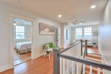 This hallway is over 20' long with original heart pine flooring