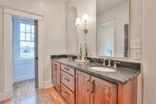 Custom vanity with leathered granite and double sinks