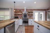 Delicious meals can be provided with gas stove in this cheerful kitchen.