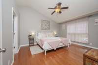 Restful primary bedroom features two walk-in closets.