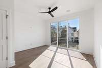 Living area with full-length sliding window.