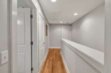 Storage closet located at top of stairs.