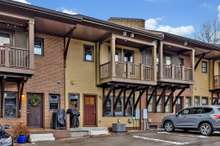 Two parking spaces allotted per unit at the rear (sylvan park lane). Guest parking available at the front (36th ave) with more spaces scattered throughout development.