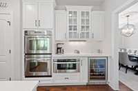 Built-in double oven, microwave and beverage fridge.