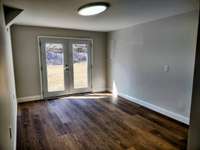 Office in Basement with natural lighting thru french doors