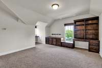 Upstairs offers custom cabinetry / desk in bonus room