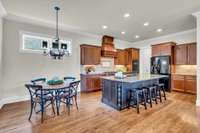 Open kitchen with large island and eat-in dining space is great for entertaining.