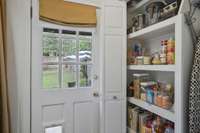 Custom Pantry across from the Laundry Area!