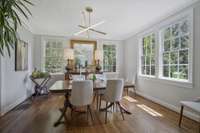 Formal, bright Dining Area with Crown Molding and Gleaming Hardwoods. Chandelier does not convey.