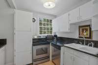 Second Level Kitchen with Granite countertops and Stainless Appliances is so convenient when guests come to stay.