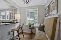 Breakfast Area attached to the kitchen with new Light fixtures, Built-in Banquette with additional storage.