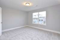Secondary bedroom is a great size!  And, it has a walk in closet! *Picture not of actual home