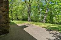 Patio out back offers privacy for warm weather entertaining with family and friends.