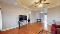 Hardwoods and the trey ceiling add a bit of comfort to this room.