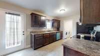 Ample counters and cabinet space round out this kitchen which also features a new dishwasher and microwave.