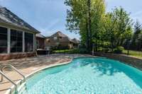 Enjoy a 5.5-foot deep inground pool complemented by a charming patio area, perfect for lounging and entertaining. Create cherished memories with family and friends in this inviting outdoor oasis, offering both relaxation and recreation.