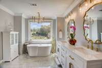 Primary bathroom up with walk in stand in shower and soaking tub.