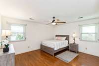 15x13 Primary Bedroom with hardwood floors.