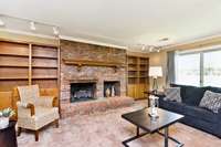 Natural gas fireplace with mantel and double built in book shelves