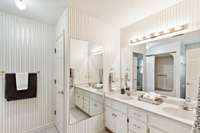 Primary ensuite with double vanity, large closet