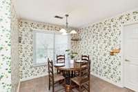 A quick coat of paint is all you need if the leaf wallpaper is not your style.  If it is, you will love the cute tiny yellow butterfly's.  This kitchen is full of cheer.