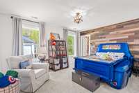 Bedroom 3 has a custom wood accent wall and a huge walk-in closet with upgraded shelving.