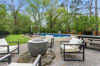 Inviting pool with fire pit. Perfect for relaxation and entertainment, day or night.