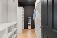 Custom shelving in primary walk-in closet. Organize with ease and style.