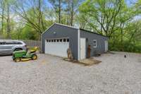 Detached 2-car garage with workshop area. Perfect for storage and hobbies.