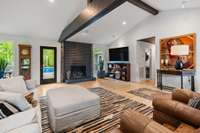Stunning home: vaulted ceilings, exposed beams, fireplace, open concept living. Modern charm meets rustic elegance.