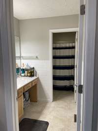 Attached bathroom to the Primary Suite - has an area to sit while getting ready for your day!