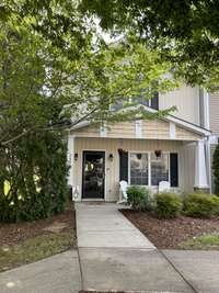 Surrounded by trees and a front storm door!