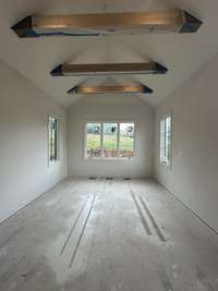 Primary Bedroom with vaulted ceiling on main level. *this home is under construction. Photo taken - 2/3/24