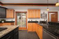 Granite countertops, tile floors and lots of lighting.